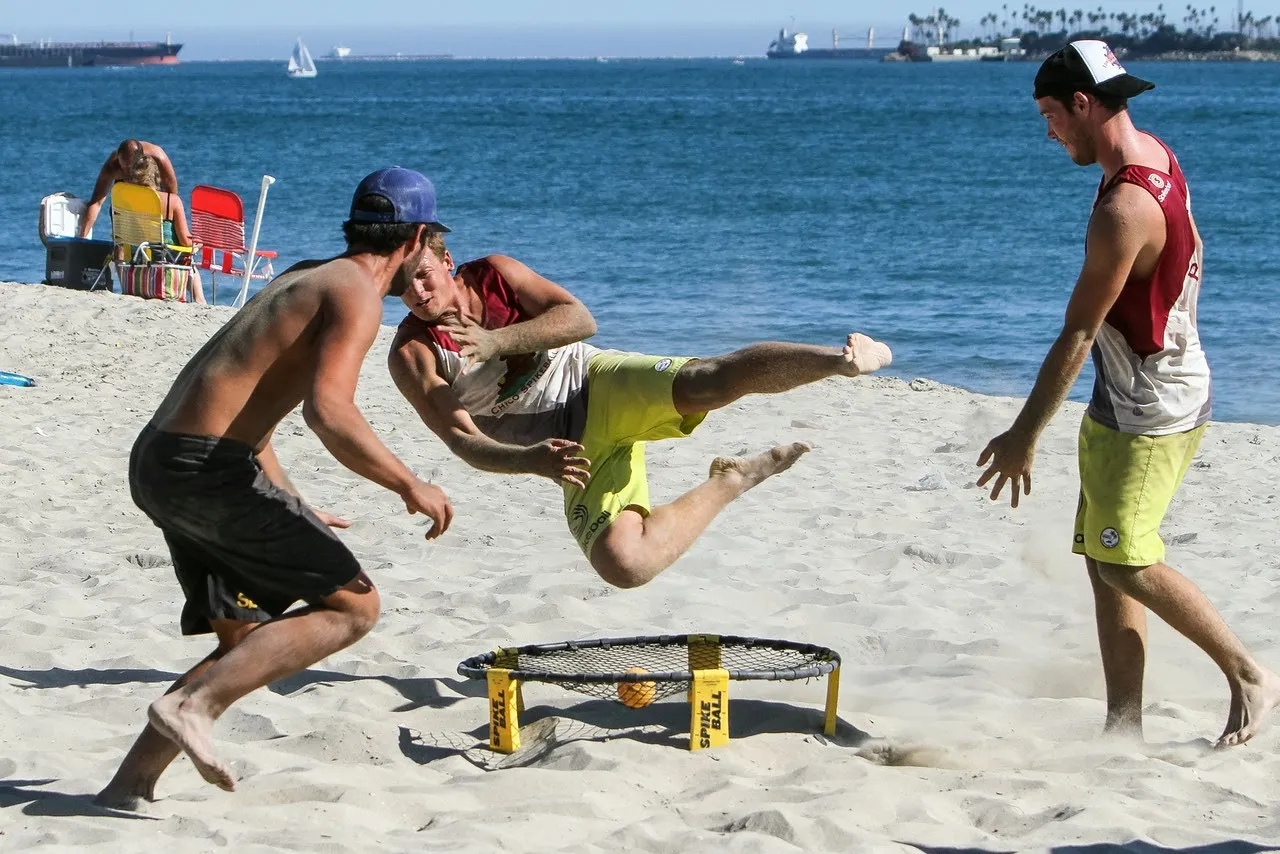 Spikeball is a popular beach game for adults.